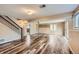Wide open basement area with wood floor and stairs at 4776 Red Rock Dr, Larkspur, CO 80118