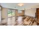 Basement living room with wood floor and access to the backyard at 4776 Red Rock Dr, Larkspur, CO 80118
