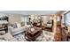 Open concept living room flowing into a modern kitchen, perfect for entertaining and Gathering gatherings at 4776 Red Rock Dr, Larkspur, CO 80118