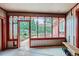 A sun room with glass enclosure and an open view to the backyard at 4776 Red Rock Dr, Larkspur, CO 80118