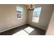 Cozy dining area with modern light fixture, and natural light from big windows at 2303 Peregrine Dr, Brighton, CO 80601