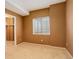 Cozy bedroom featuring neutral walls, neutral carpeting, and plenty of natural light at 2855 Rock Creek Cir # 129, Superior, CO 80027