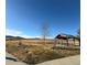 Community space featuring a wooden gazebo, picnic table, and mountain views in the distance at 2855 Rock Creek Cir # 129, Superior, CO 80027