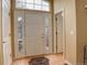 Bright foyer with tiled floor, sidelight windows, and an arched transom window at 2855 Rock Creek Cir # 129, Superior, CO 80027
