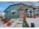 Attractive two-story home boasts mature landscaping, prominent windows, and inviting entrance with covered porch at 2855 Rock Creek Cir # 129, Superior, CO 80027