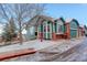 Charming two-story home features updated exterior, attached garages, and professionally landscaped front yard in winter at 2855 Rock Creek Cir # 129, Superior, CO 80027