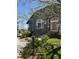 Inviting home exterior with beautiful landscaping, stone walkway, and well-maintained lawn at 2855 Rock Creek Cir # 129, Superior, CO 80027