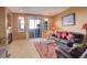 Cozy living room with a fireplace, sliding glass doors, and comfortable leather furniture at 2855 Rock Creek Cir # 129, Superior, CO 80027
