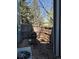 Back patio area enclosed by a wood fence and equipped with a grill at 2855 Rock Creek Cir # 129, Superior, CO 80027