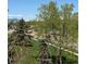 Scenic view of the surrounding green landscape and distant mountains through mature trees at 2855 Rock Creek Cir # 129, Superior, CO 80027