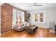 Bright living room featuring hardwood floors, large windows, and comfortable seating at 1351 N Washington St # 15, Denver, CO 80203