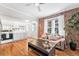Cozy living room with exposed brick wall, hardwood floors, and modern furnishings at 1351 N Washington St # 15, Denver, CO 80203