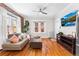 Inviting living room with hardwood floors, exposed brick wall, and contemporary decor at 1351 N Washington St # 15, Denver, CO 80203