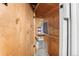 Small storage room with shelves containing cleaning supplies and mechanical equipment at 1351 N Washington St # 15, Denver, CO 80203