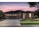 Charming single-story home featuring stone accents, a two-car garage, and a well-maintained front yard at 4125 N Duquesne Ct, Aurora, CO 80019