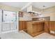 Basement laundry and wet bar area at 1007 Oriole Cir, Brighton, CO 80601