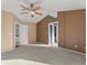 Spacious bedroom with neutral tones, ceiling fan, and an ensuite bathroom entrance at 16212 Blueleaf Pl, Parker, CO 80134