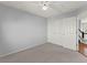 Bedroom features natural light, a ceiling fan, and a double door closet with ample storage at 16212 Blueleaf Pl, Parker, CO 80134