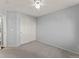 Bright bedroom featuring neutral colored walls and carpet, as well as a large double door closet at 16212 Blueleaf Pl, Parker, CO 80134
