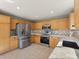 Modern kitchen featuring stainless steel appliances and tiled backsplash at 16212 Blueleaf Pl, Parker, CO 80134