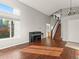 Bright room featuring hardwood floors, stairs, and high windows at 16212 Blueleaf Pl, Parker, CO 80134