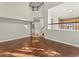 Open living space with hardwood flooring, natural lighting, and staircase at 16212 Blueleaf Pl, Parker, CO 80134