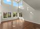 Bright living room with hardwood floors and many windows that bring in natural light at 16212 Blueleaf Pl, Parker, CO 80134