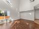 Large living room featuring hardwood floors, natural light, and neutral paint at 16212 Blueleaf Pl, Parker, CO 80134