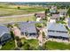 An aerial perspective reveals the house's beautiful landscaping, back porch, and peaceful setting at 5439 Innisbrook Loop, Elizabeth, CO 80107