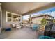 Covered back porch featuring a table and seating, ideal for relaxing and enjoying the outdoors at 5439 Innisbrook Loop, Elizabeth, CO 80107