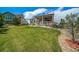 The backyard features a large lawn and a covered back porch perfect for relaxation and entertaining at 5439 Innisbrook Loop, Elizabeth, CO 80107