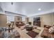 Inviting basement living area with a warm fireplace, a cozy seating arrangement, and a stylish area rug at 5439 Innisbrook Loop, Elizabeth, CO 80107