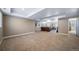 Spacious basement with carpet flooring, neutral walls, and comfortable seating area for entertainment and relaxation at 5439 Innisbrook Loop, Elizabeth, CO 80107