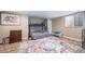 Bedroom with a bunk bed, dresser, and a bright window at 5439 Innisbrook Loop, Elizabeth, CO 80107