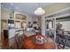 Dining area with hardwood floors and access to an outdoor patio with chairs at 5439 Innisbrook Loop, Elizabeth, CO 80107