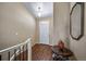 Inviting entryway featuring hardwood floors, a white door, and neutral wall colors at 5439 Innisbrook Loop, Elizabeth, CO 80107