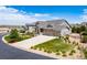 A well-manicured lawn and three-car garage are showcased in this exterior view of the home at 5439 Innisbrook Loop, Elizabeth, CO 80107