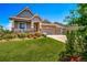 Inviting home with a well-maintained lawn and a spacious three-car garage at 5439 Innisbrook Loop, Elizabeth, CO 80107