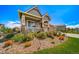 Charming home featuring well-manicured front yard with decorative rocks and colorful flowers at 5439 Innisbrook Loop, Elizabeth, CO 80107
