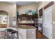 Gourmet kitchen with stainless steel appliances, granite countertops, and breakfast bar seating at 5439 Innisbrook Loop, Elizabeth, CO 80107