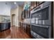 Gourmet kitchen equipped with stainless steel appliances and sleek dark cabinetry at 5439 Innisbrook Loop, Elizabeth, CO 80107