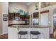 Eat-in kitchen featuring stainless steel appliances and ample countertop space for cooking and entertaining at 5439 Innisbrook Loop, Elizabeth, CO 80107