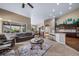 Bright living room with large windows, hardwood floors, and an open floor plan at 5439 Innisbrook Loop, Elizabeth, CO 80107