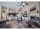 Cozy living room and kitchen with high ceilings, fireplace, and lots of natural light at 5439 Innisbrook Loop, Elizabeth, CO 80107