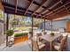 Outdoor patio features a dining area with seating for six, an outdoor kitchen and cozy lounge area at 3050 S Delaware St, Englewood, CO 80110