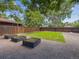 Landscaped backyard features a well-maintained lawn, gravel area, and raised garden beds at 3050 S Delaware St, Englewood, CO 80110