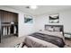 This bedroom features a stylish closet, a comfortable bed, and tasteful wall decor at 3050 S Delaware St, Englewood, CO 80110