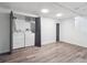 Well-lit laundry room equipped with modern washer and dryer, offering convenience and functionality at 3050 S Delaware St, Englewood, CO 80110