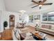 Bright living room featuring hardwood floors, neutral furniture, and dining area at 3050 S Delaware St, Englewood, CO 80110