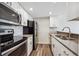 Well-equipped kitchen features stainless steel appliances, ample counter space, and modern finishes at 4273 S Salida Way # 1, Aurora, CO 80013